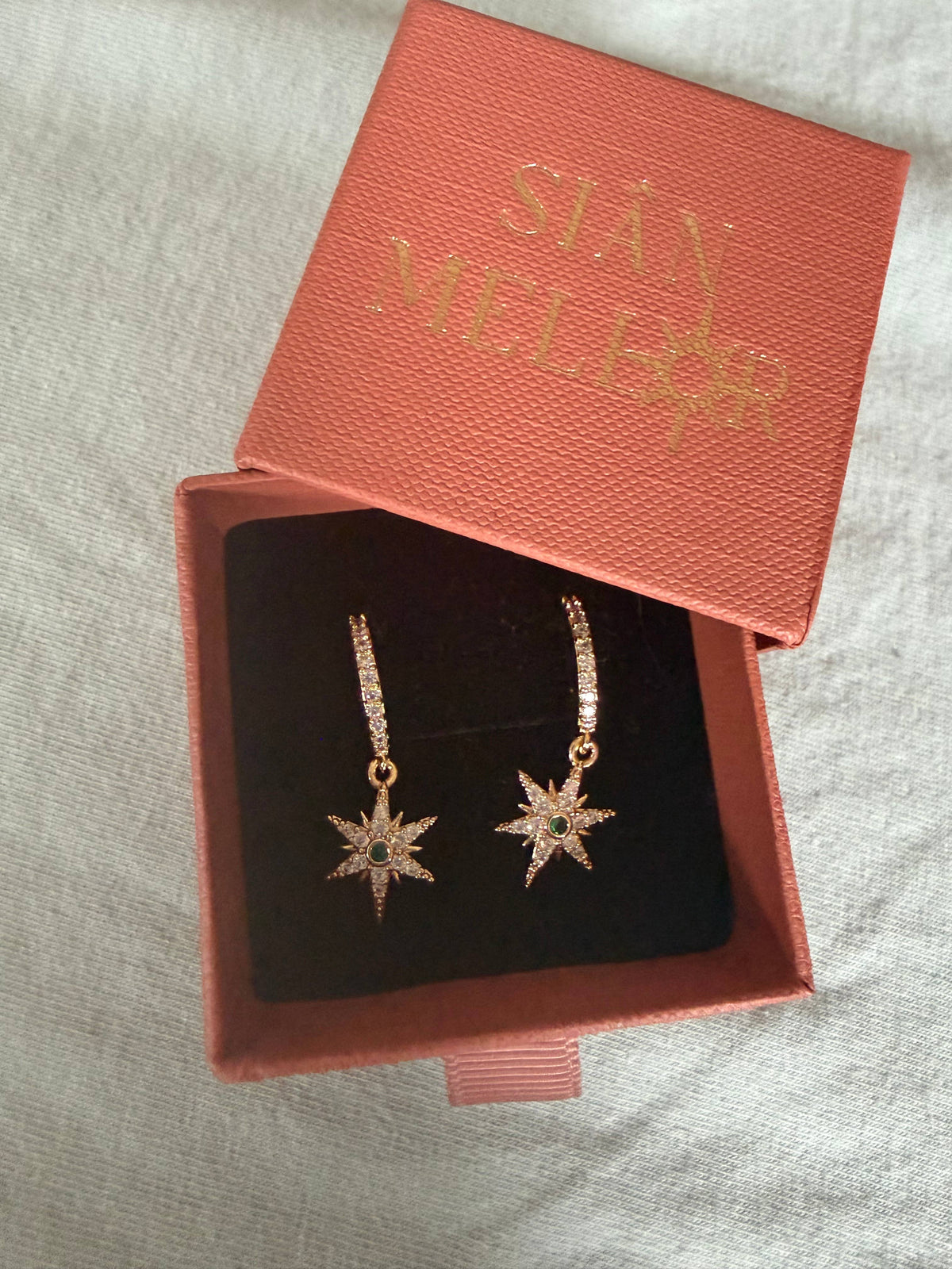 Sparkly small star huggie hoop earrings