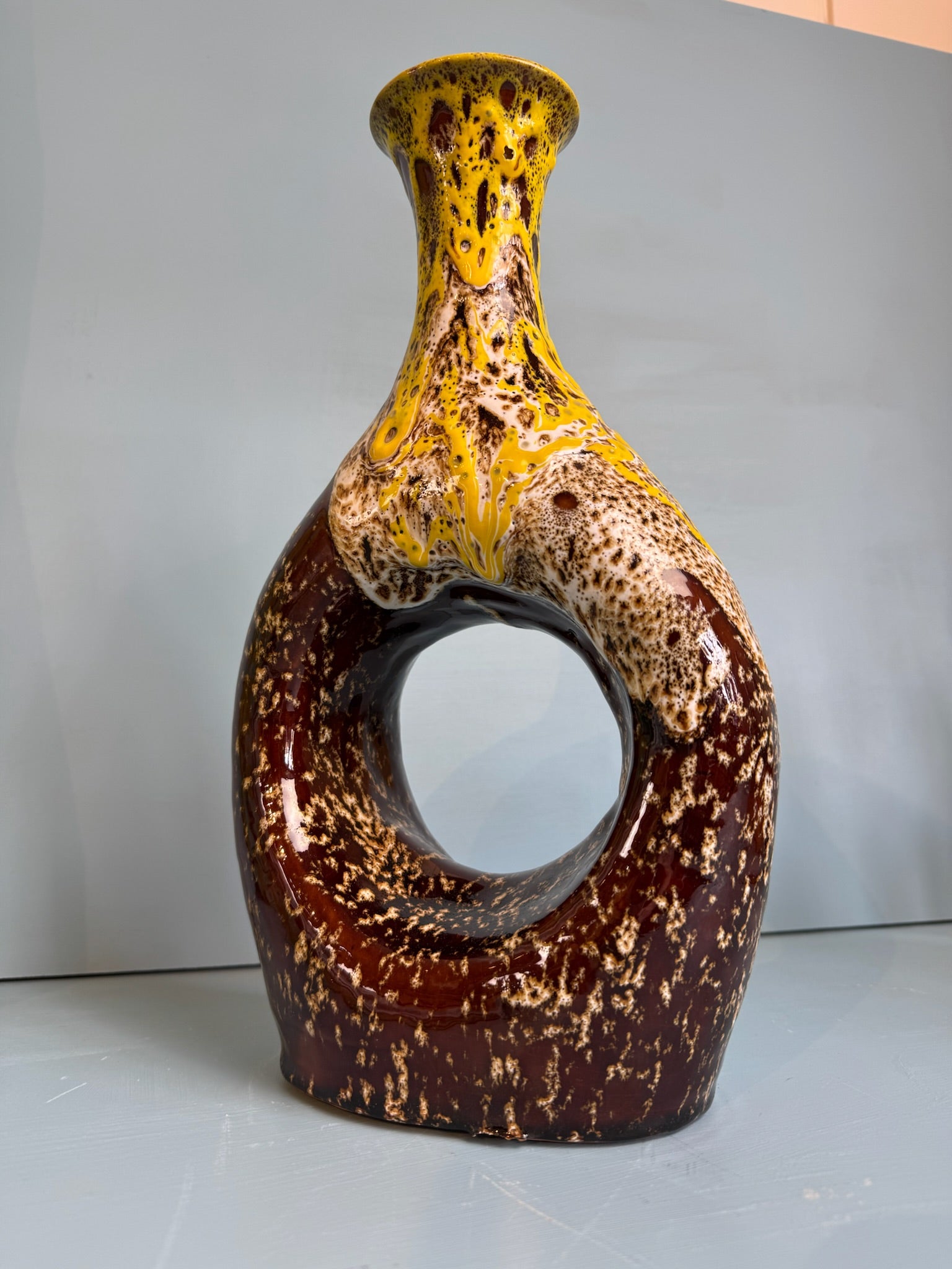 Large brown yellow vase with hole