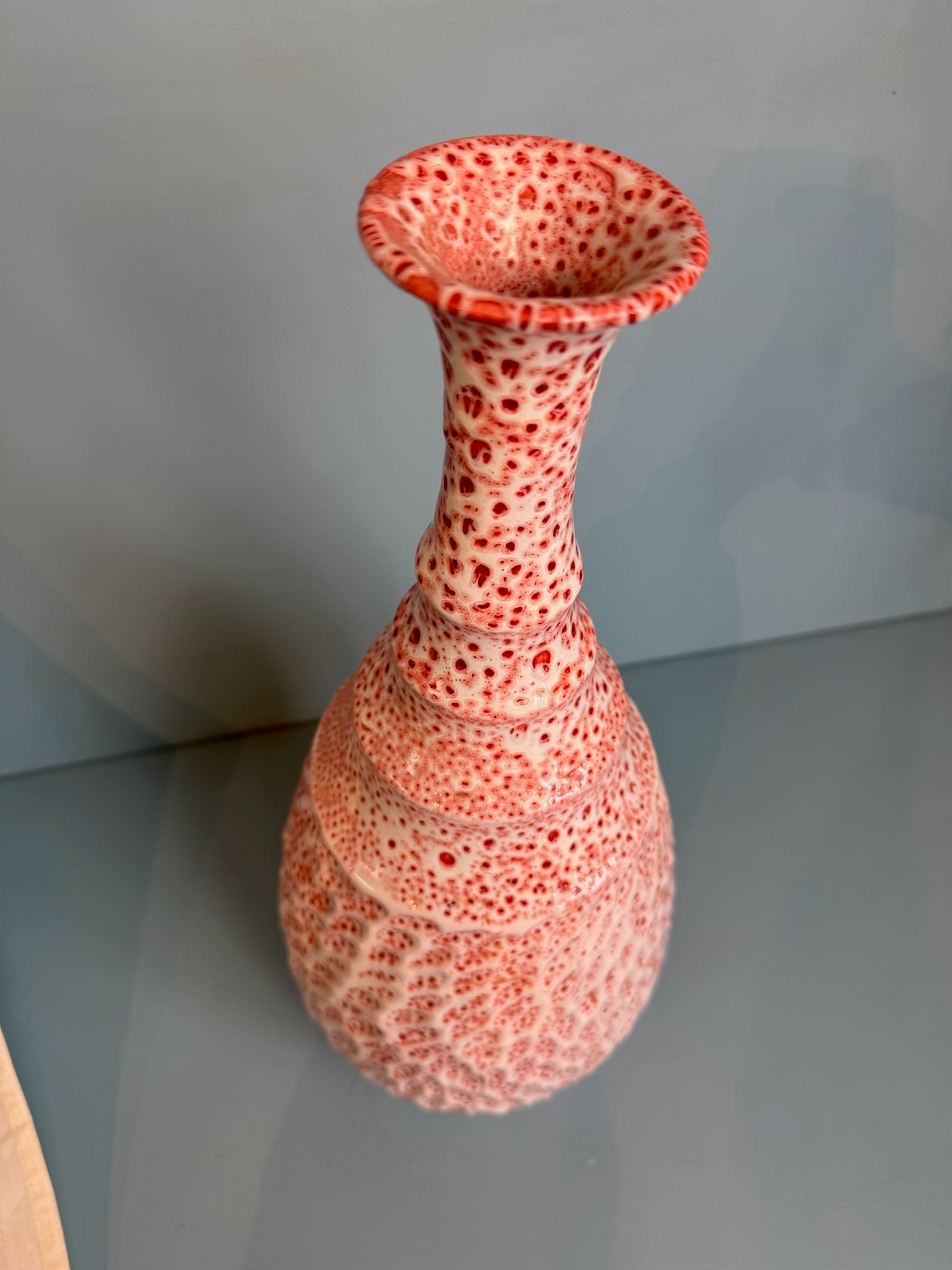 Light red/pink vase with thin neck